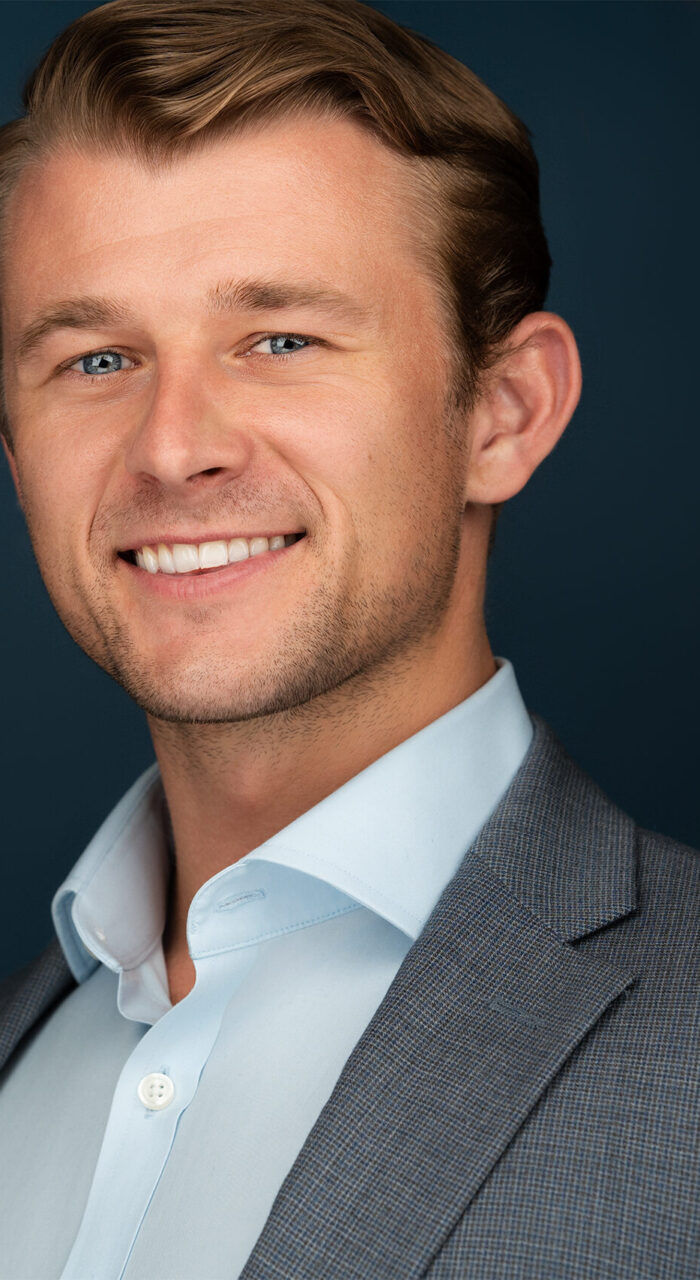 Blonde Gentleman Smiling, Corporate Headshot, Suit, blue background