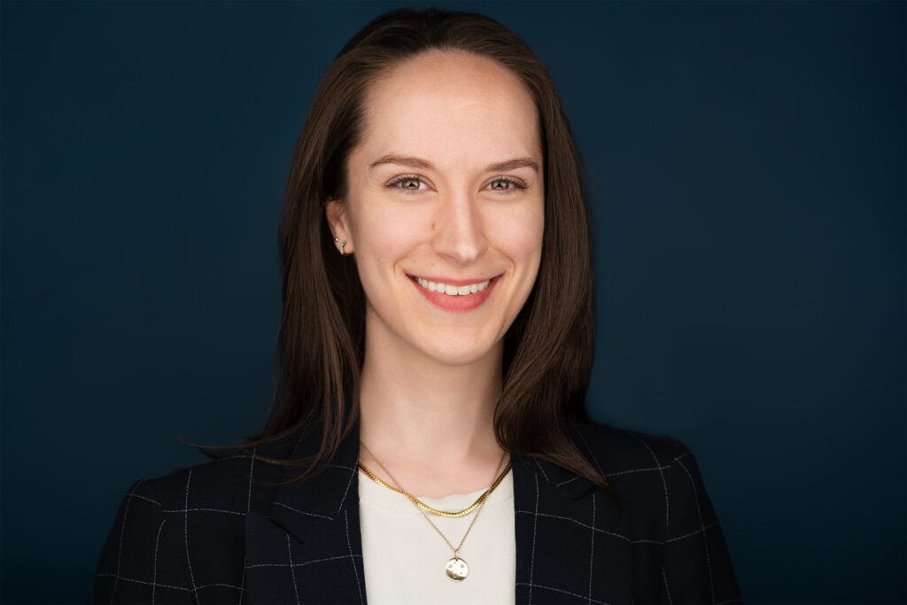 Brunette lady smiling, corporate headshot NYC