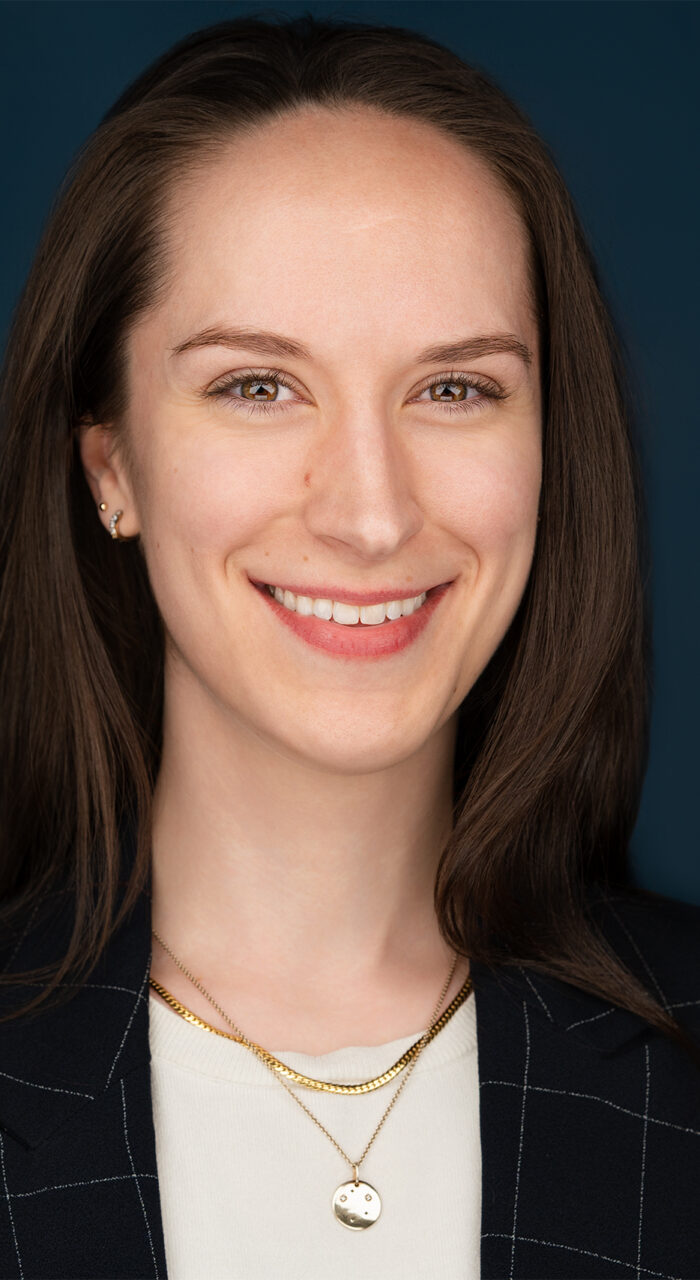 Brunette lady smiling, corporate headshot NYC