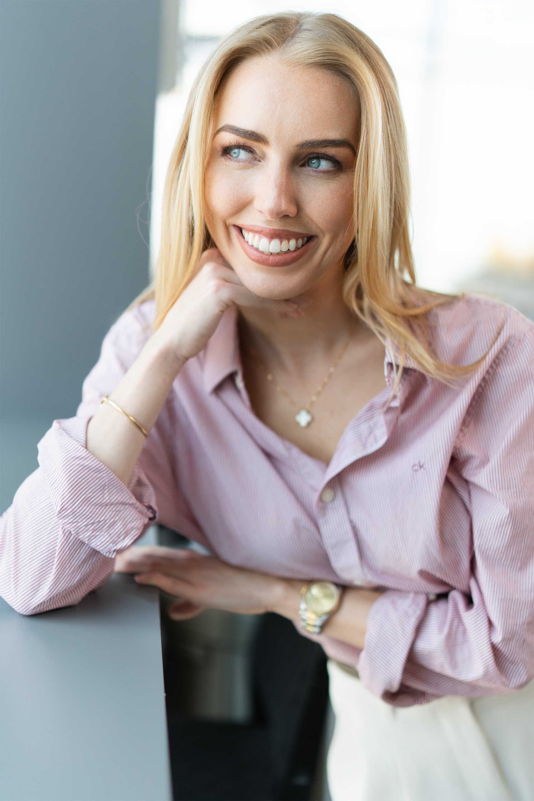 blonde blue eye woman looking away from camera, fun, approachable, candid, portrait nyc