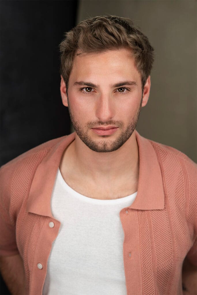 Young gentleman, rose colored textured button down with white undershirt, sexy but rough look. NYC Headshot Photographer, Actor