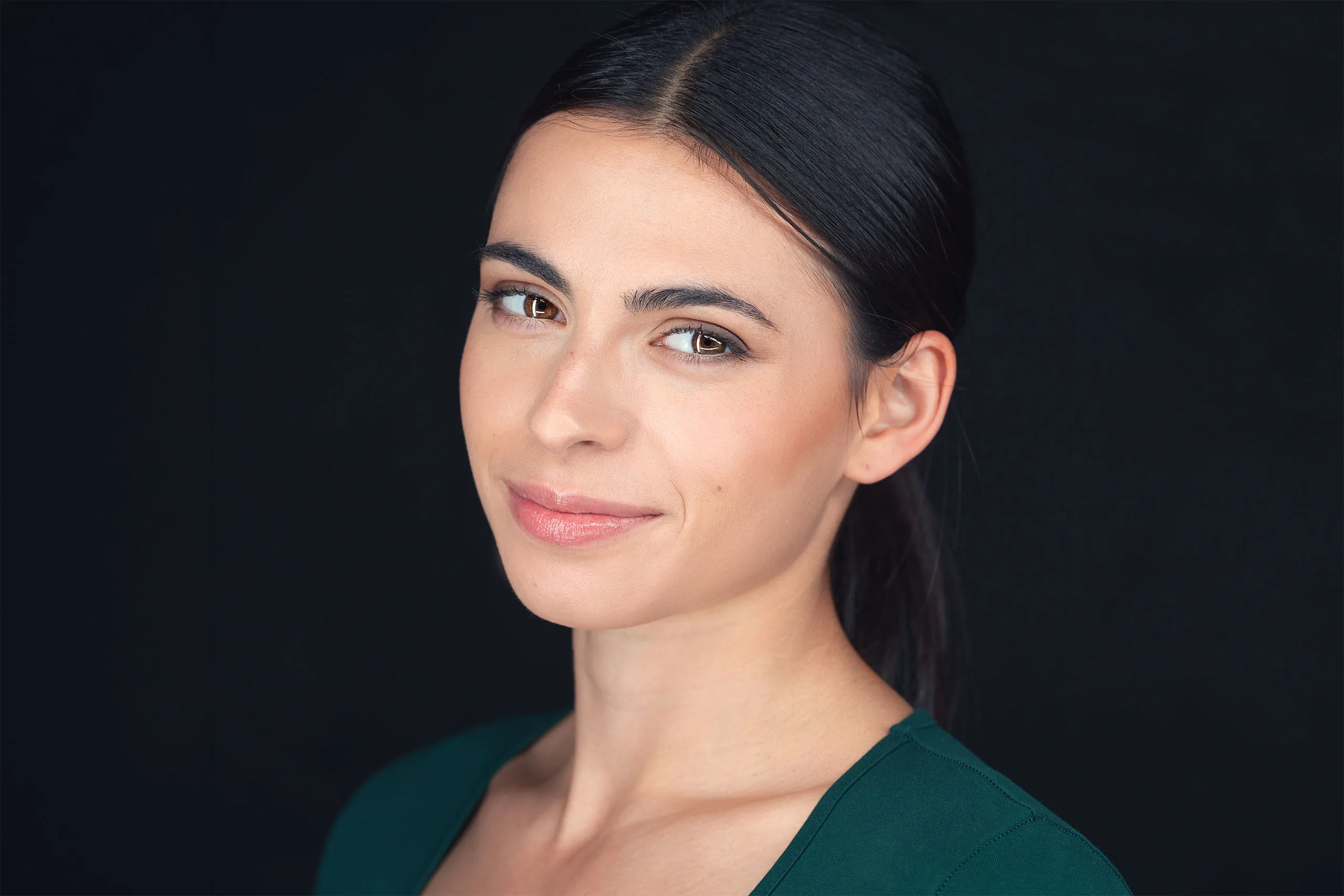 Actor headshot of Amy Puchini against a dark blue background