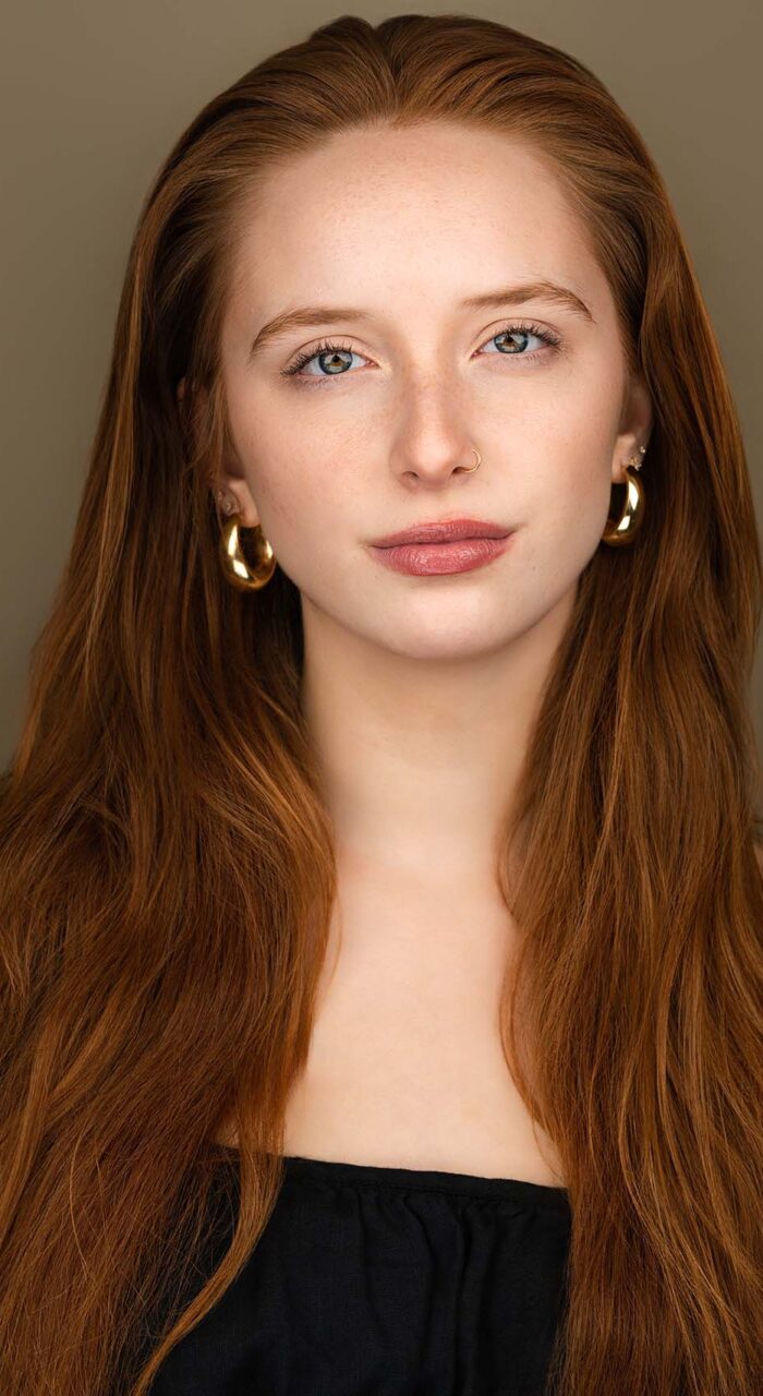 Actor headshot of Arianna Holden against a taupe background